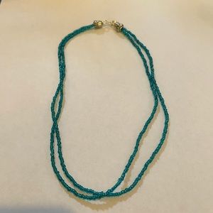 Blue beaded necklace, doubles as a bracelet